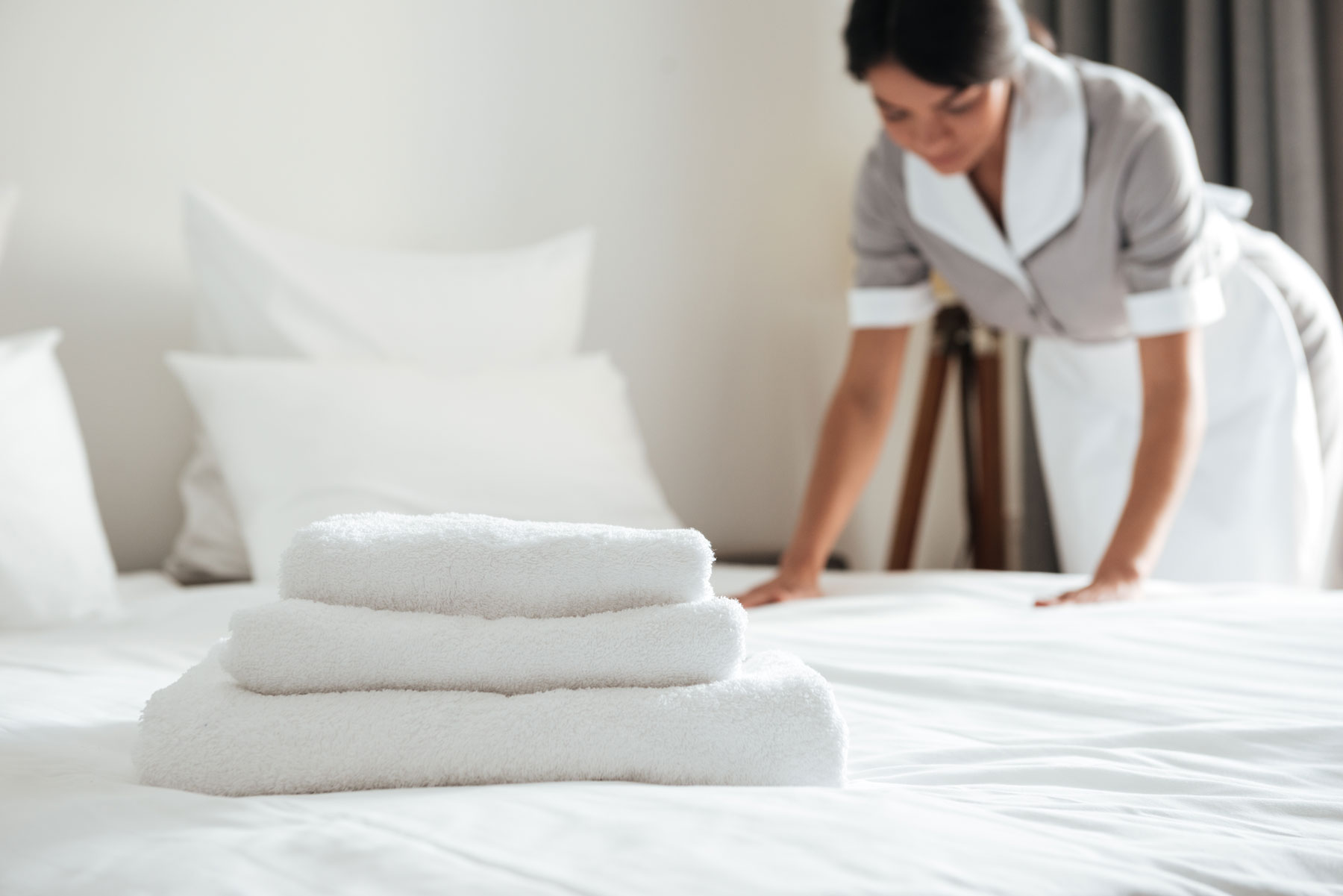 Hotel - Maid service making bed