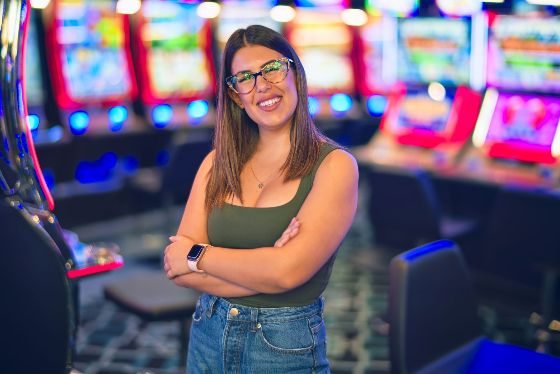 Account Login - Woman smiling, enjoying her time in the slots area of the casino